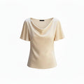 Beige draped cowl-neck blouse with short sleeves and soft neckline drape.