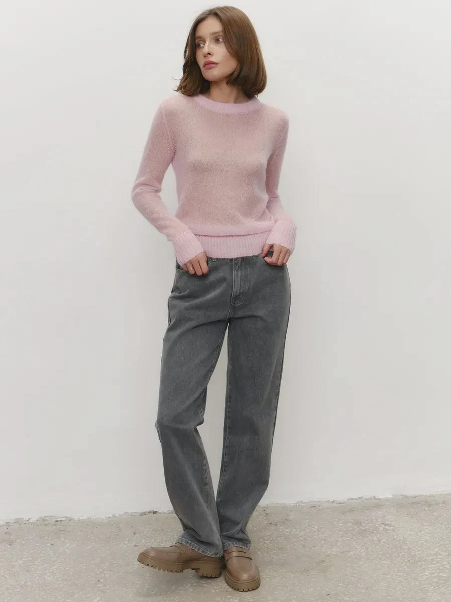 Lightweight crewneck knit sweater in pale mauve with long sleeves and ribbed cuffs.