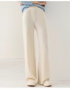 Women’s wide-leg knit pants in cream, front view cropped at waist and down to shoes