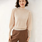 Beige merino turtleneck sweater with long puff sleeves and ribbed hem