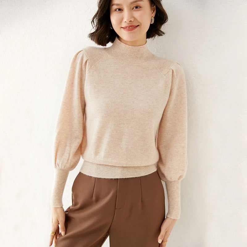 Beige merino turtleneck sweater with long puff sleeves and ribbed hem
