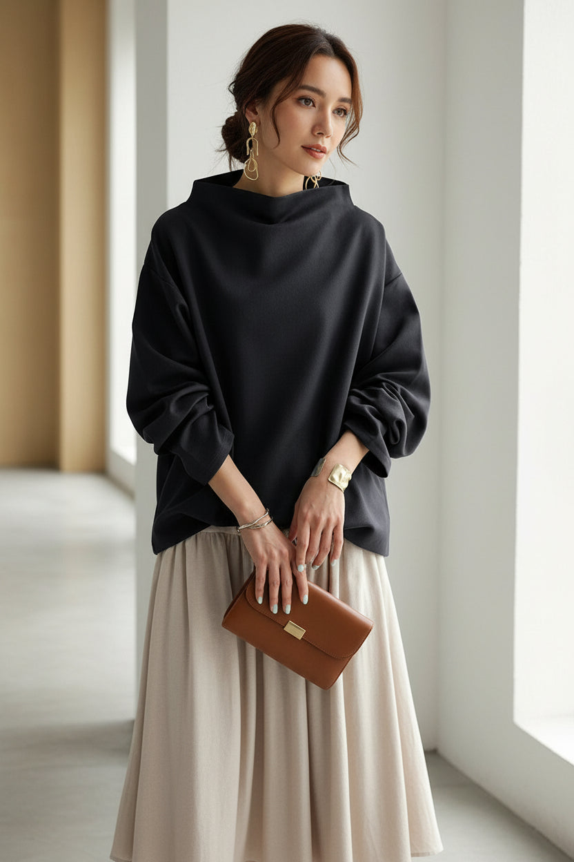 Black high-neck casual top with long sleeves and draped oversized fit
