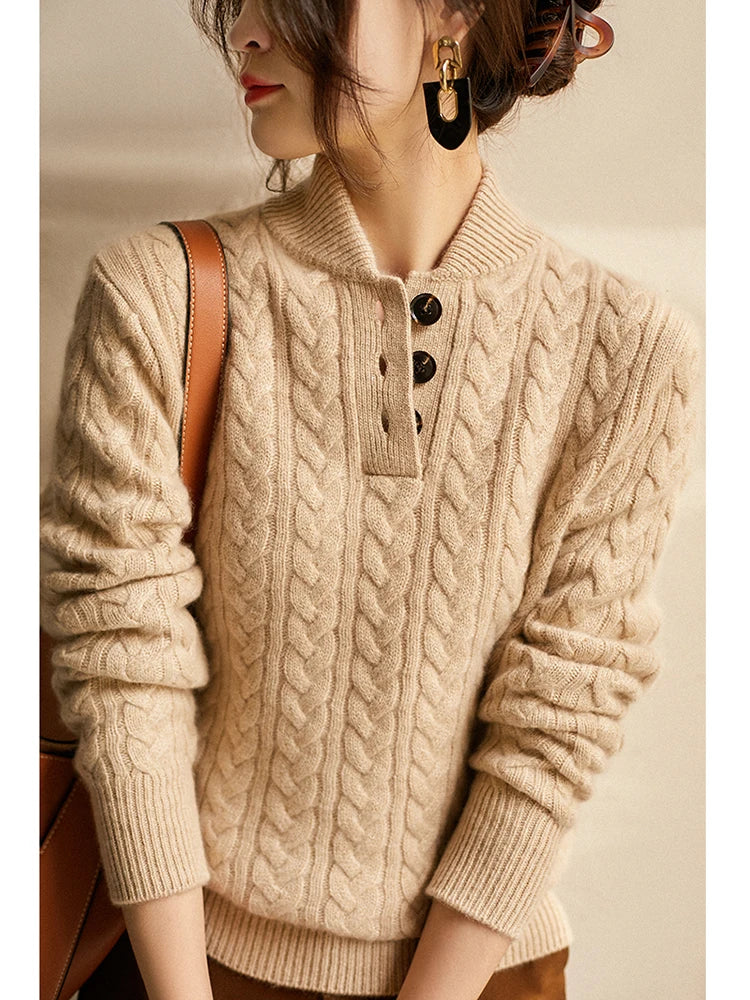 Cream cable-knit cashmere button-up sweater with short button placket and ribbed hem.