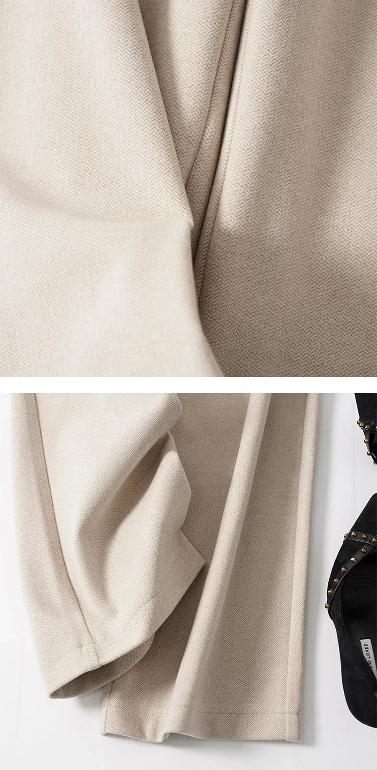 Light beige wide-leg trousers with soft drape and visible seam at inner leg