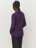 Purple crewneck knit sweater from the back view with ribbed hem