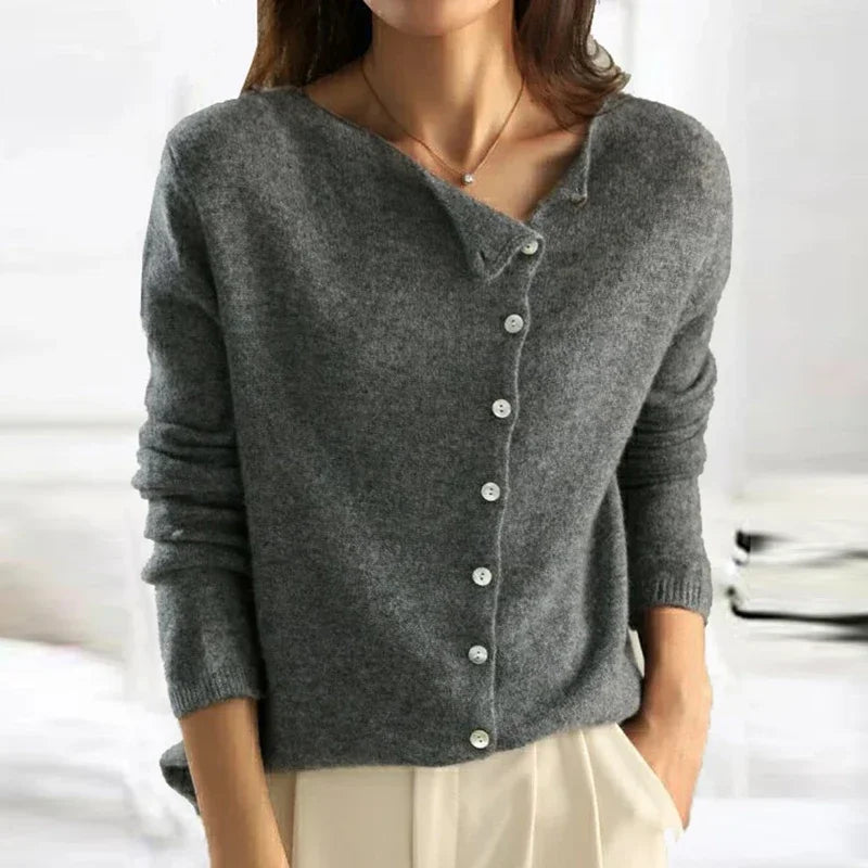 Gray knit sweater with V-neck, front button closure, and ribbed cuffs