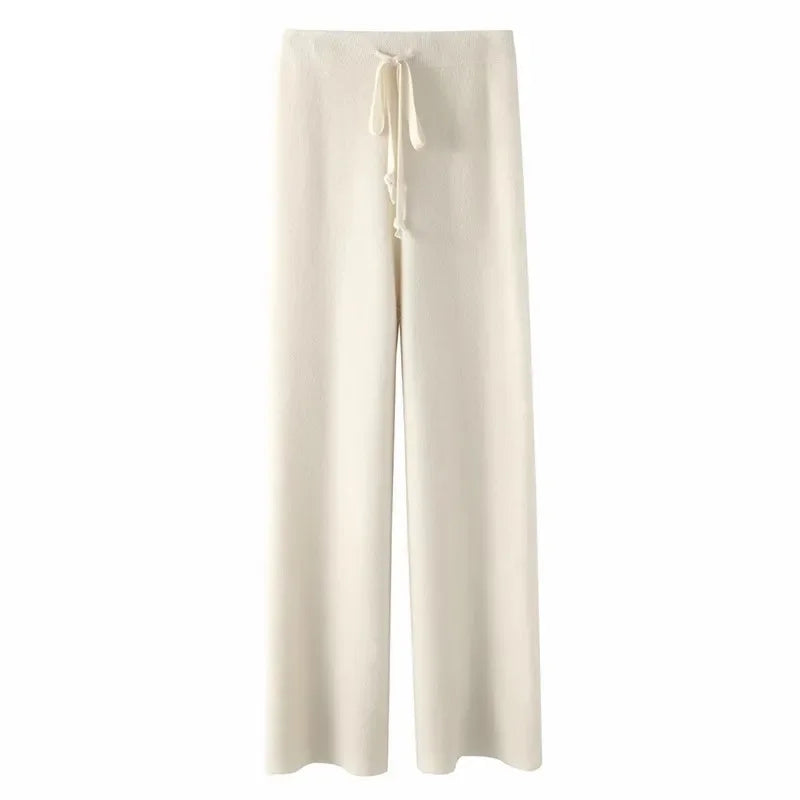 White wide-leg lounge pants with high elastic waistband and drawstring tie.