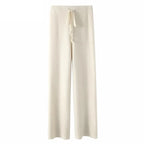 White wide-leg lounge pants with high elastic waistband and drawstring tie.