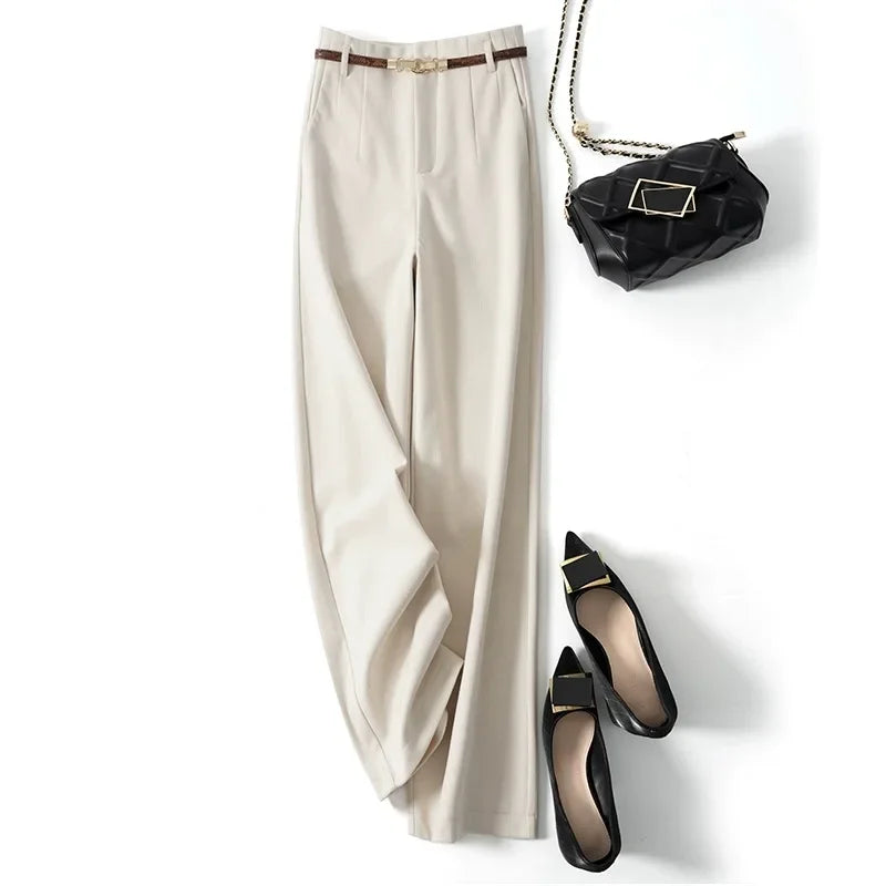 White high-waisted wide-leg trousers flat lay with belt at waistband
