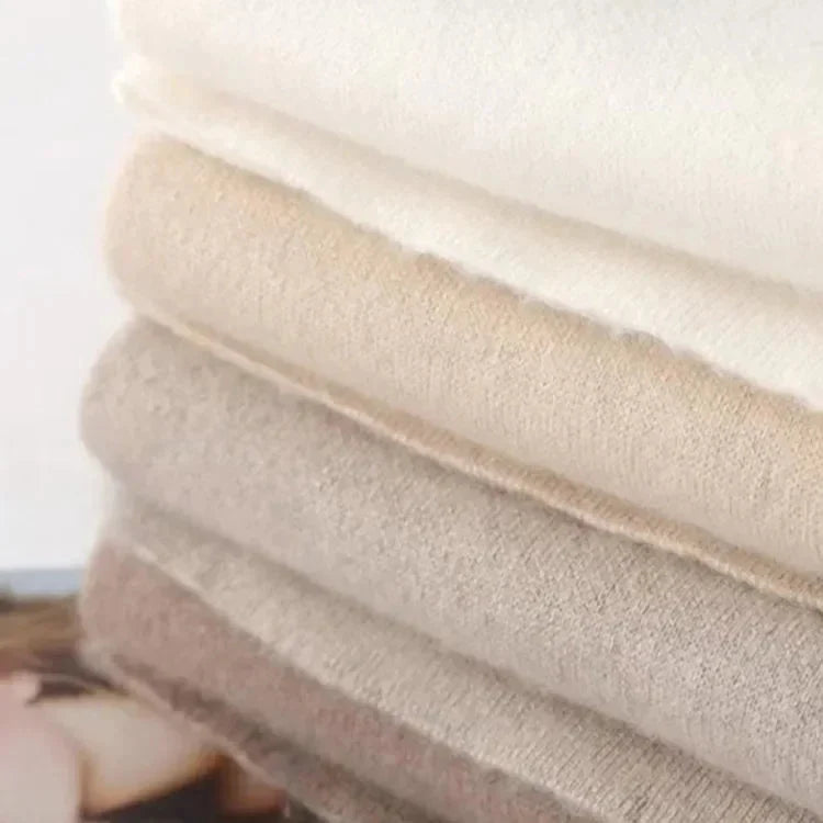 Light beige knit lounge pants waistband and fabric close-up, with soft texture.