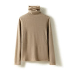 Camel slim fit turtleneck knit sweater on a hanger, folded collar and long sleeves.