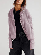Lavender waffle zip hoodie with hood and front buttons, styled over a dark top.