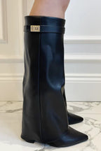 Black leather tall heeled boots with gold buckle across the top cuff.