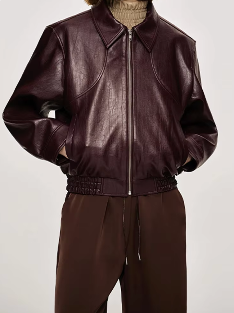 Burgundy zip-up bomber jacket with stand collar, ribbed cuffs, and gathered hem