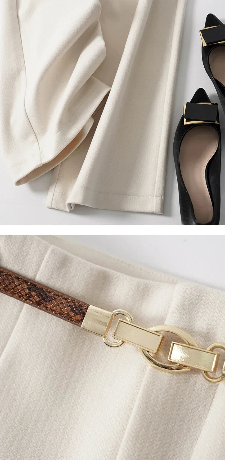 White wide-leg trousers showing drape and side seam with belt at the waist
