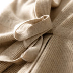 Women’s merino wool sweater vest tie detail, light beige rib-knit