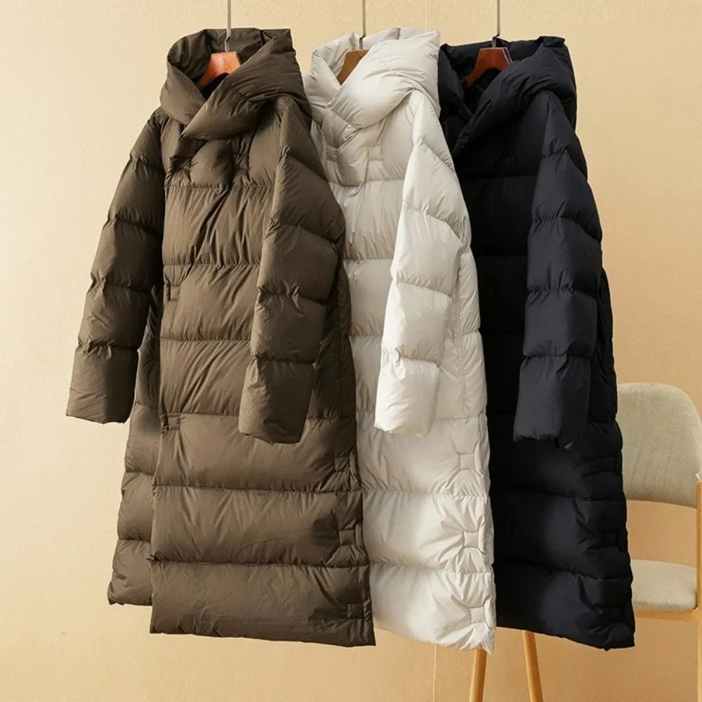Long down puffer parkas with hoods in brown, white, and black, quilted zip fronts