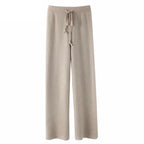Light gray-beige wide-leg lounge pants with high elastic waistband and drawstring.