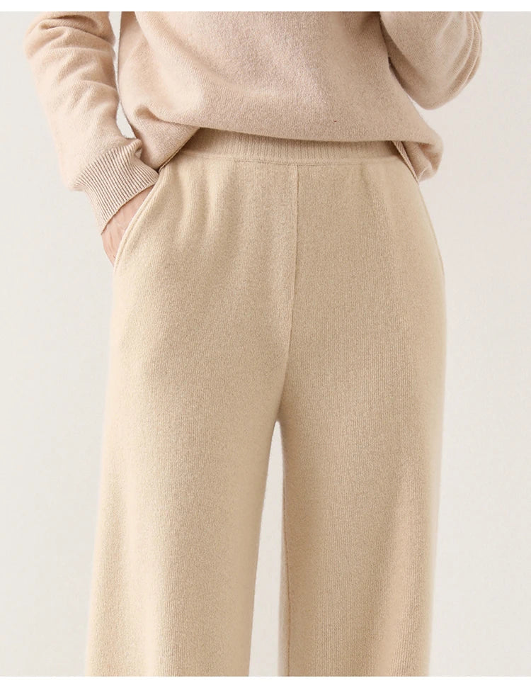 Women’s wide-leg knit pants in cream, close-up of front seams and knit surface