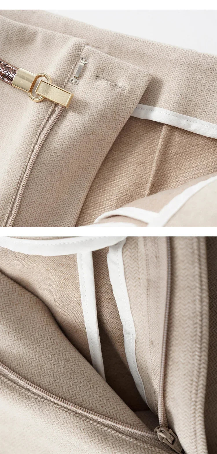Beige trousers with front zipper opening and belt at the high waist