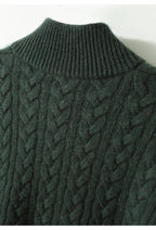 Dark green cable-knit cashmere sweater with ribbed high collar and textured knit