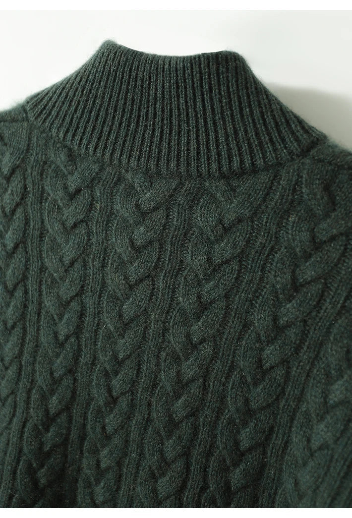 Dark green cable-knit cashmere sweater with ribbed high collar and textured knit