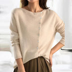 Light beige asymmetrical button knit sweater, long sleeves, ribbed cuffs