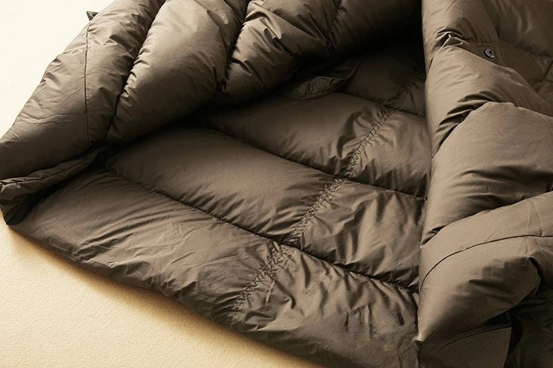 Long down puffer parka with hood, dark brown quilted interior layer detail