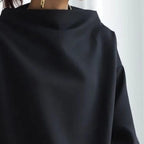 Black high-neck casual top, close-up of the neckline and smooth fabric