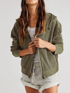 Olive waffle-knit hoodie with hood drawstrings and front kangaroo pocket.