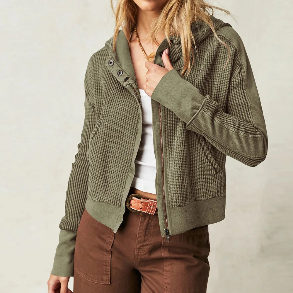 Olive waffle-knit hoodie with hood, center-front zipper, and snap placket detail.