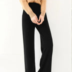 Black merino wool wide-leg knit pants with relaxed waist and soft fabric drape.