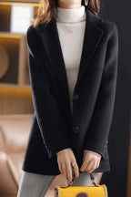 Black wool blazer, notched lapel, button front closure, welt pockets, tailored silhouette