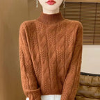 Chestnut brown cable knit mock neck sweater with textured cable front and ribbed hem.