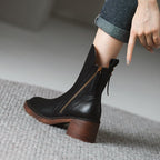 Black ankle boot with side zipper and tassel ties, rounded toe, block heel
