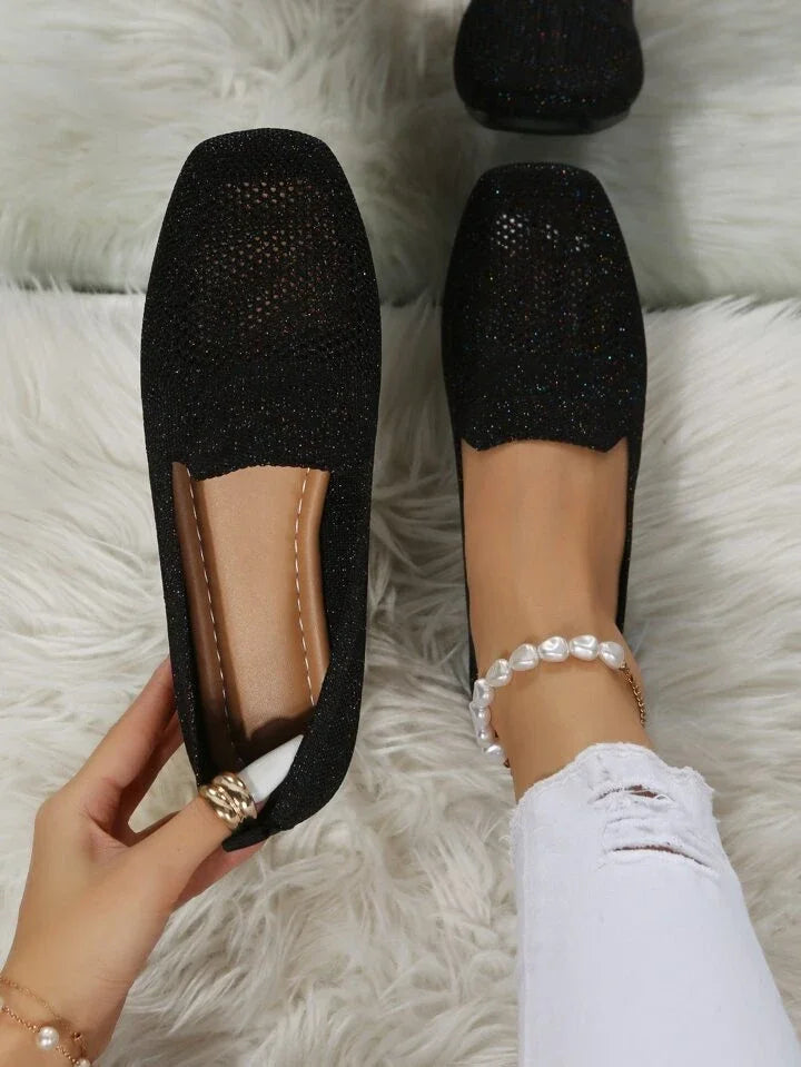 Black perforated knit loafer with round toe and slip-on fit