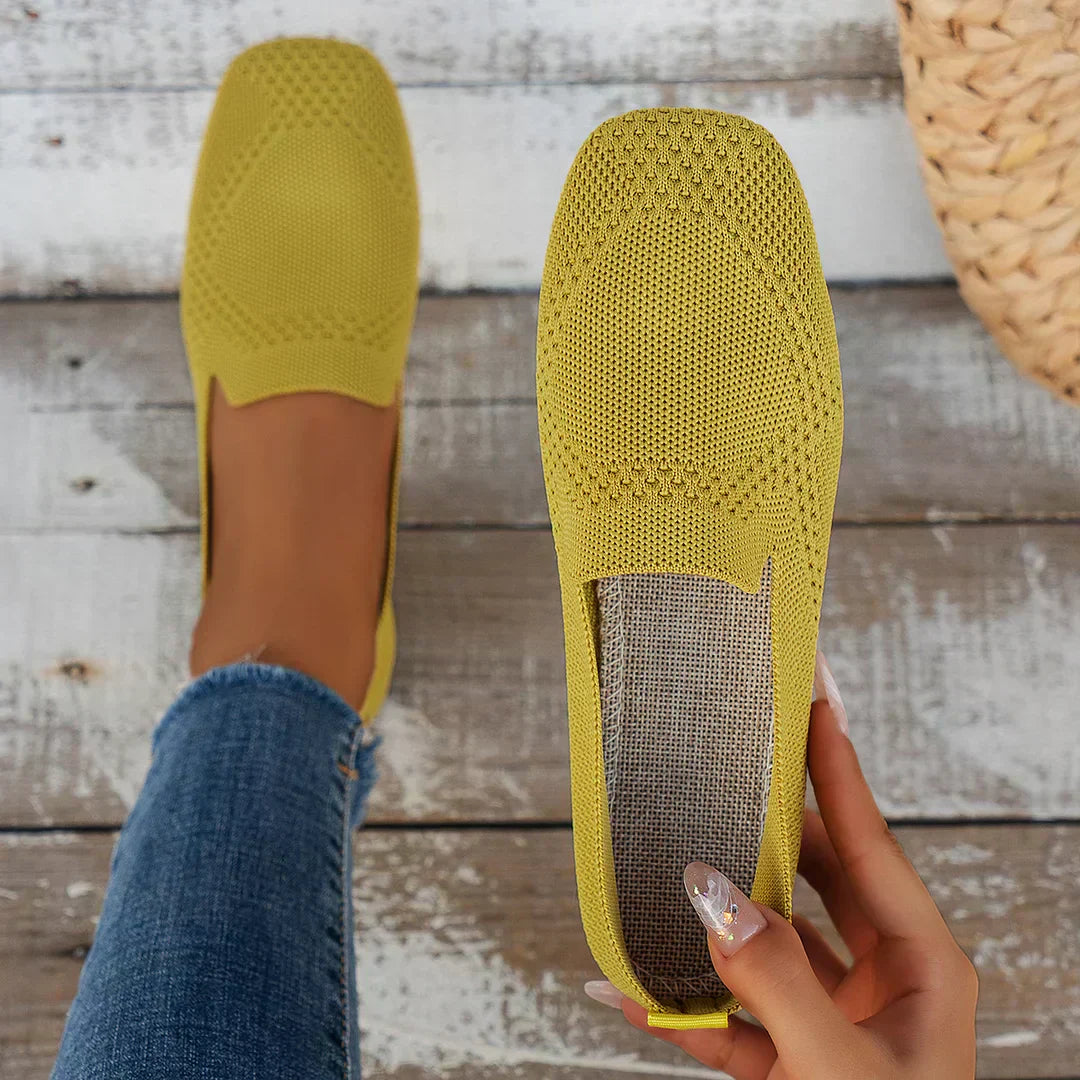 Mustard yellow perforated knit loafer with round toe and slip-on style
