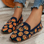 Navy knit slip-on loafer with playful orange patterned toe