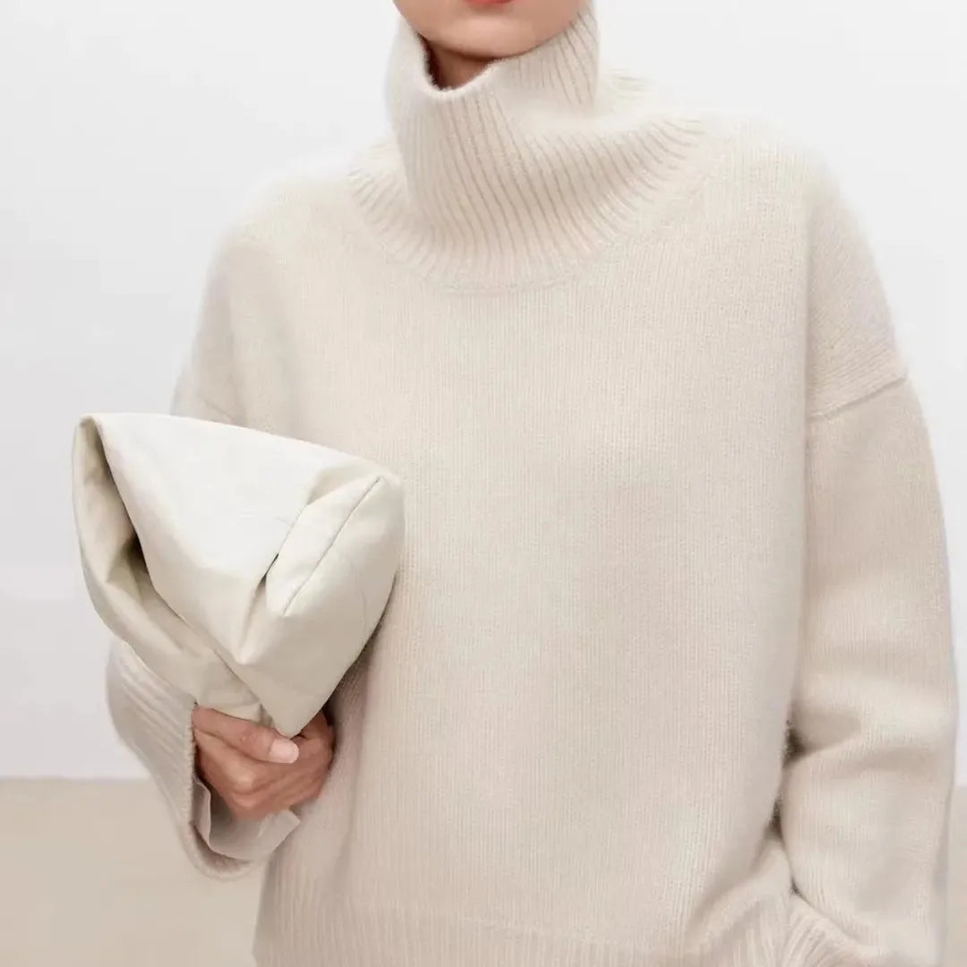 Cream oversized turtleneck knit sweater with ribbed collar and long sleeves