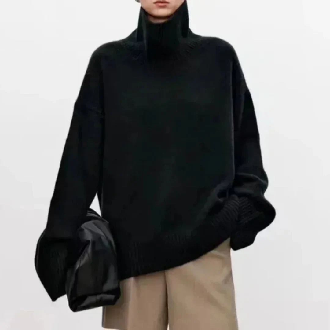 Black oversized turtleneck knit sweater with ribbed collar and roomy long sleeves