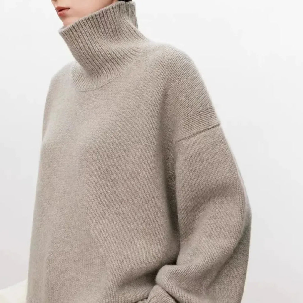 Light gray turtleneck knit sweater, ribbed collar and sleeve cuffs