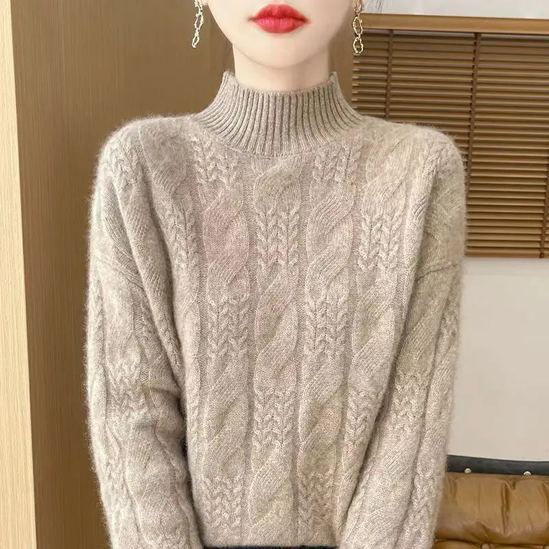 Light gray cable knit mock neck sweater, textured front cables and ribbed cuffs and hem.