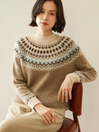 Camel knit sweater with mock neck and Fair Isle yoke pattern, ribbed cuffs and hem.