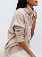 Light beige oversized merino-wool blend turtleneck sweater, ribbed collar and sleeve cuffs