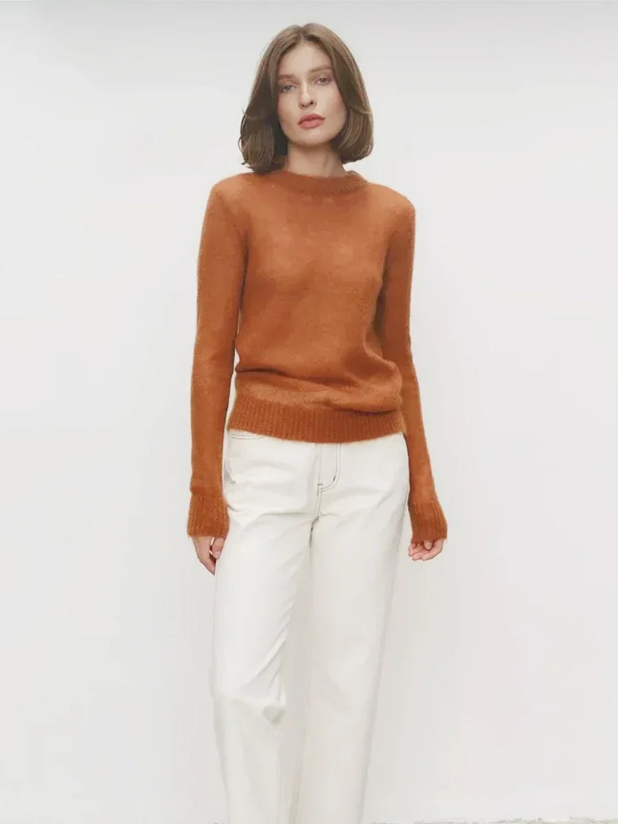Lightweight crewneck knit sweater in rust orange with long sleeves and ribbed hem.