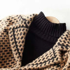 Close-up houndstooth knit jacket with contrast black ribbed yoke and tan knit border