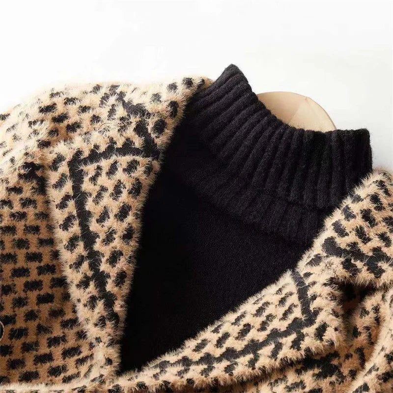 Close-up houndstooth knit jacket with contrast black ribbed yoke and tan knit border
