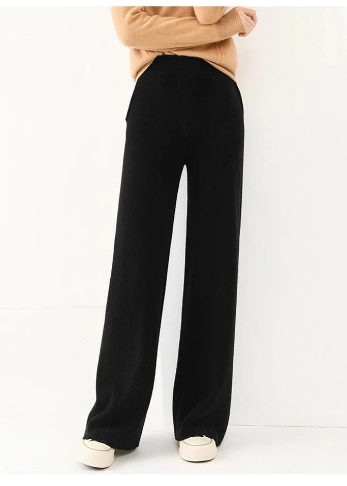 Black merino wool wide-leg knit pants, full-length wide leg with clean hemline.