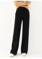 Black merino wool wide-leg knit pants, full-length wide leg with clean hemline.