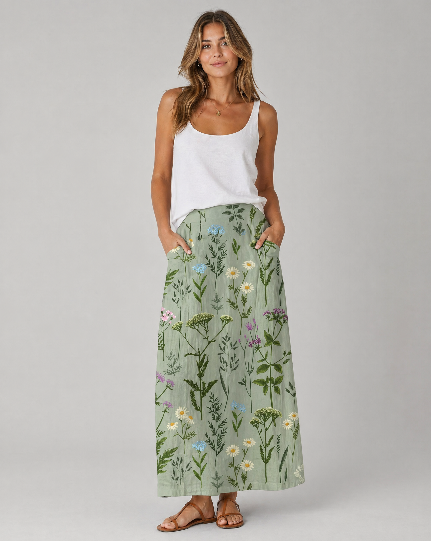 Green field-print A-line skirt with pockets, midi length, front close view